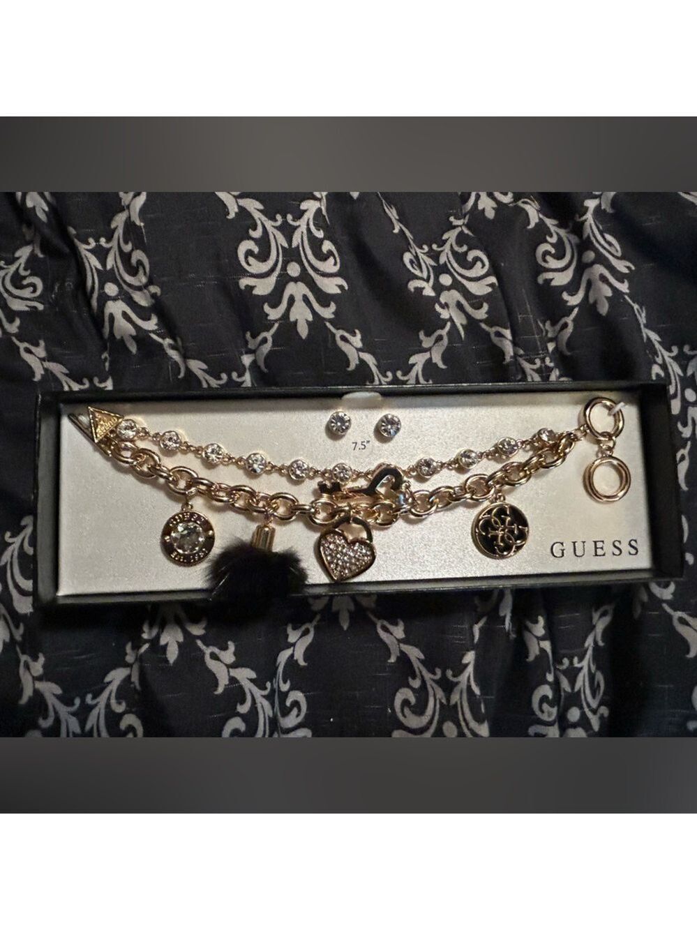 Guess  lose angels  bracelet with matching earrings set